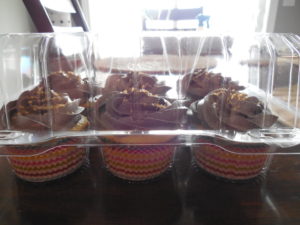 Yellow cupcakes with chocolate frosting